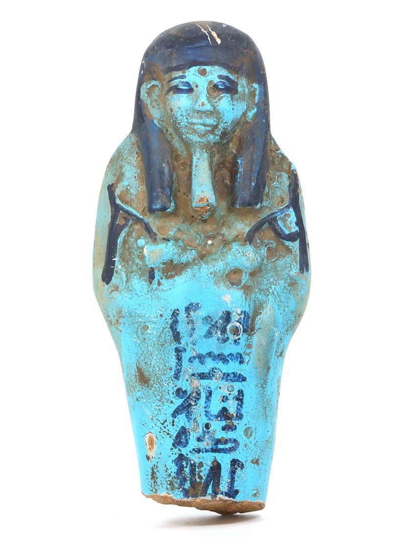 An Egyptian Terracotta Ushabti: A Fragment of Eternity: This notable terracotta ushabti fragment stands as a larger testament to the ancient Egyptian civilization, its height reaching 15 cm. Its once-vivid turquoise glaze overlays the earthen terracotta, c
