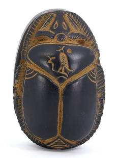 An Egyptian Hieroglyphic Narrative Scarab: Delve into the enigmatic allure of this Egyptian scarab, a compact chronicle etched in stone. Its 8 by 5 cm form is a tapestry of hieroglyphs, a language of symbols telling a tale lost to time. Crafte