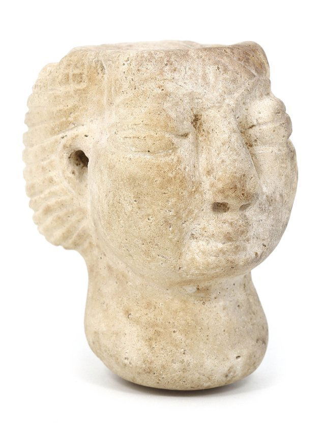 A Bactrian Marble Head, Late 3rd Millennium B.C.: This exquisite Bactrian marble head, with its dimensions of 5.5 cm by 4.5 cm, represents the sophisticated craftsmanship of the Bactrian culture from the late 3rd millennium B.C. The stylistic feature