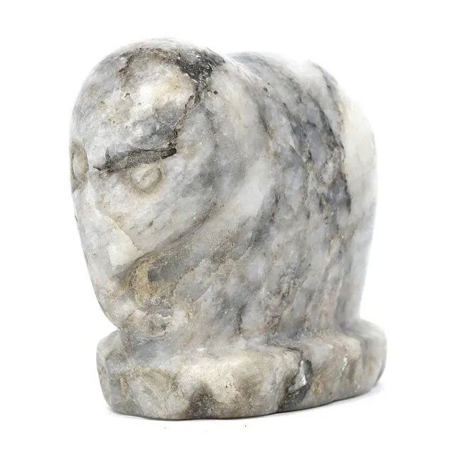 A Carved Marble Elephant, Near Eastern Folk Art: An endearing marble elephant, its form hewn from a single block of stone, radiates the charm of Near Eastern folk art. Standing at a modest five centimeters, the elephant’s rough yet tangible detail