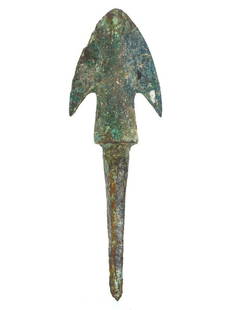 A Bronze Luristan Spearhead, Early Iron Age, ca. 1000-650 B.C.: This bronze Luristan spearhead is a striking example of Early Iron Age weaponry, distinguished by its elongated blade and characteristic wings, which not only served a practical purpose in preventing