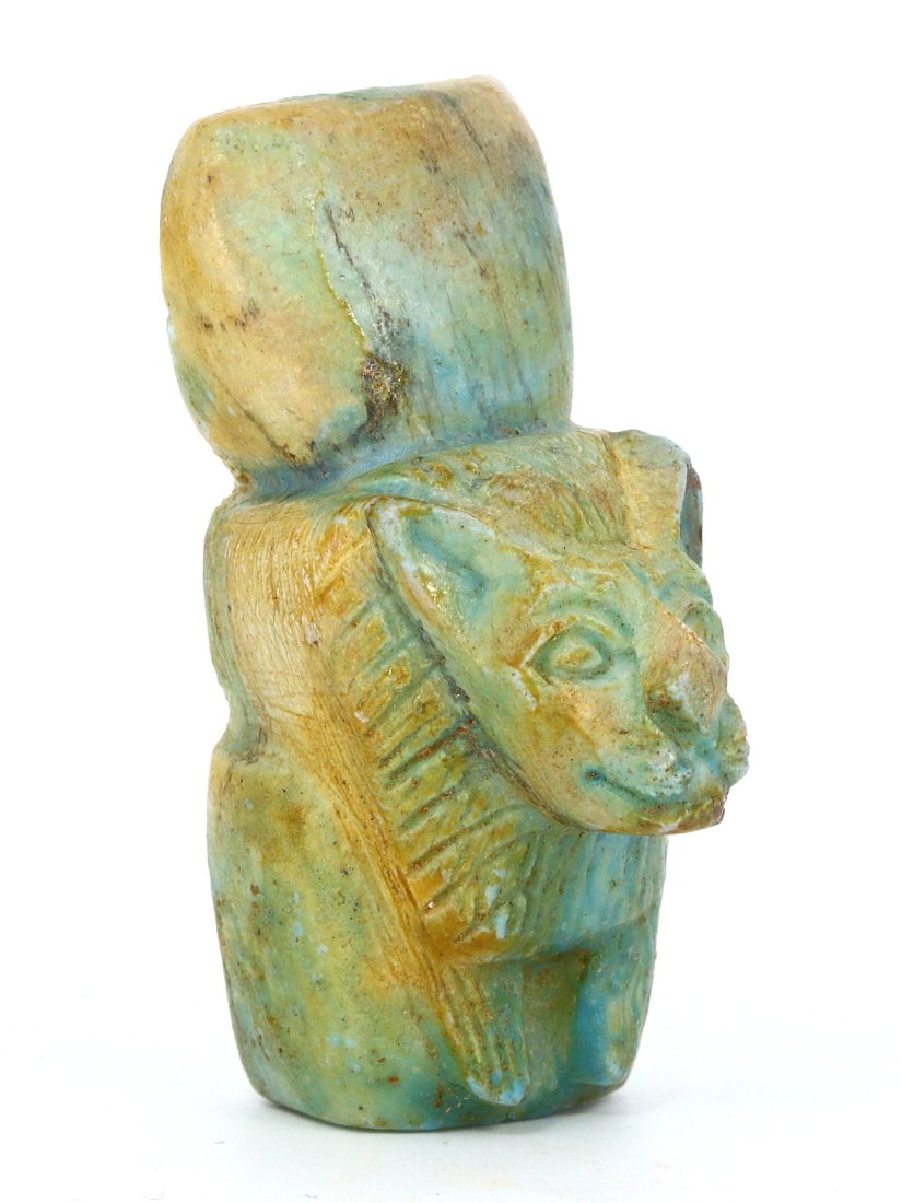 An Egyptian Glazed Steatite Amulet of Maahes: Dimensions: 2.36 x 1.06 inches (6 x 2.7 cm)