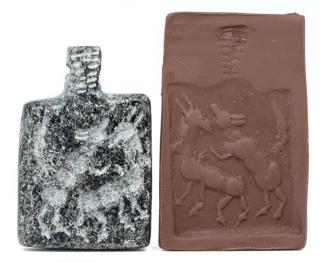 An Egyptian Basalt Amulet with Hieroglyphic Stamp Seal: Dimensions: 1.57 x 0.98 inches (4 x 2.5 cm)