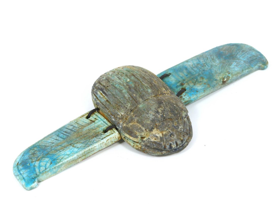 An Egyptian Glazed Steatite Winged Scarab: Dimensions: 5.1 x 2.4 inches (13 x 6 cm)