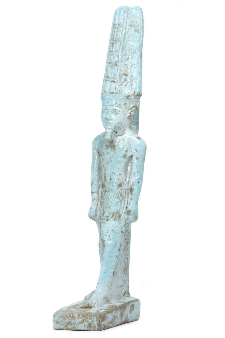 An Egyptian Faience Amun Figurine: Dimensions: 6.1 x 1.8 inches (15.4 x 4.6 cm)