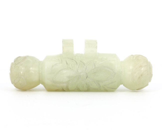 A Byzantine-Islamic Antique Floral Carved Amulet, Circa 8th-10th Century: This delicately carved amulet, measuring 6.5 x 2 cm, possibly hails from the Byzantine-Islamic period, given its stylistic floral motifs and the light green semi-precious stone from which it is fashio