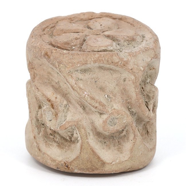 An Ancient Byzantine Engraved Terracotta Seal, Circa 5th-7th Century CE: This artifact is a terracotta seal of 3.5 cm diameter, featuring a deeply engraved floral pattern reminiscent of Byzantine decorative motifs from the 5th to 7th centuries CE. The design likely served 
