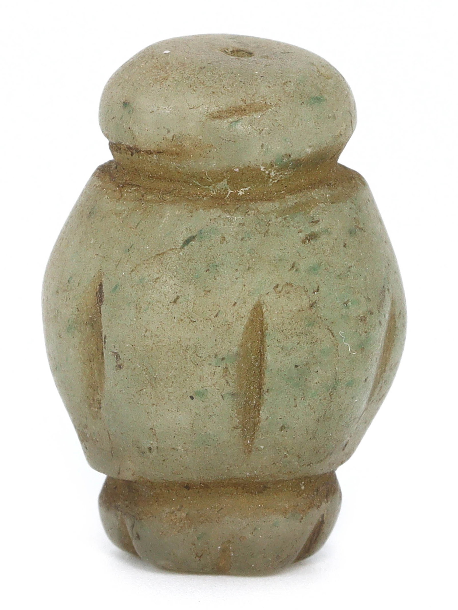 An Antique Collar Chrysoprase Bead, Qing Dynasty, circa 1644-1912: This elegant collar bead, made from chrysoprase, showcases the artistic finesse of the Qing Dynasty. The smooth, green gemstone with subtle textures is renowned for its calming properties, often used 