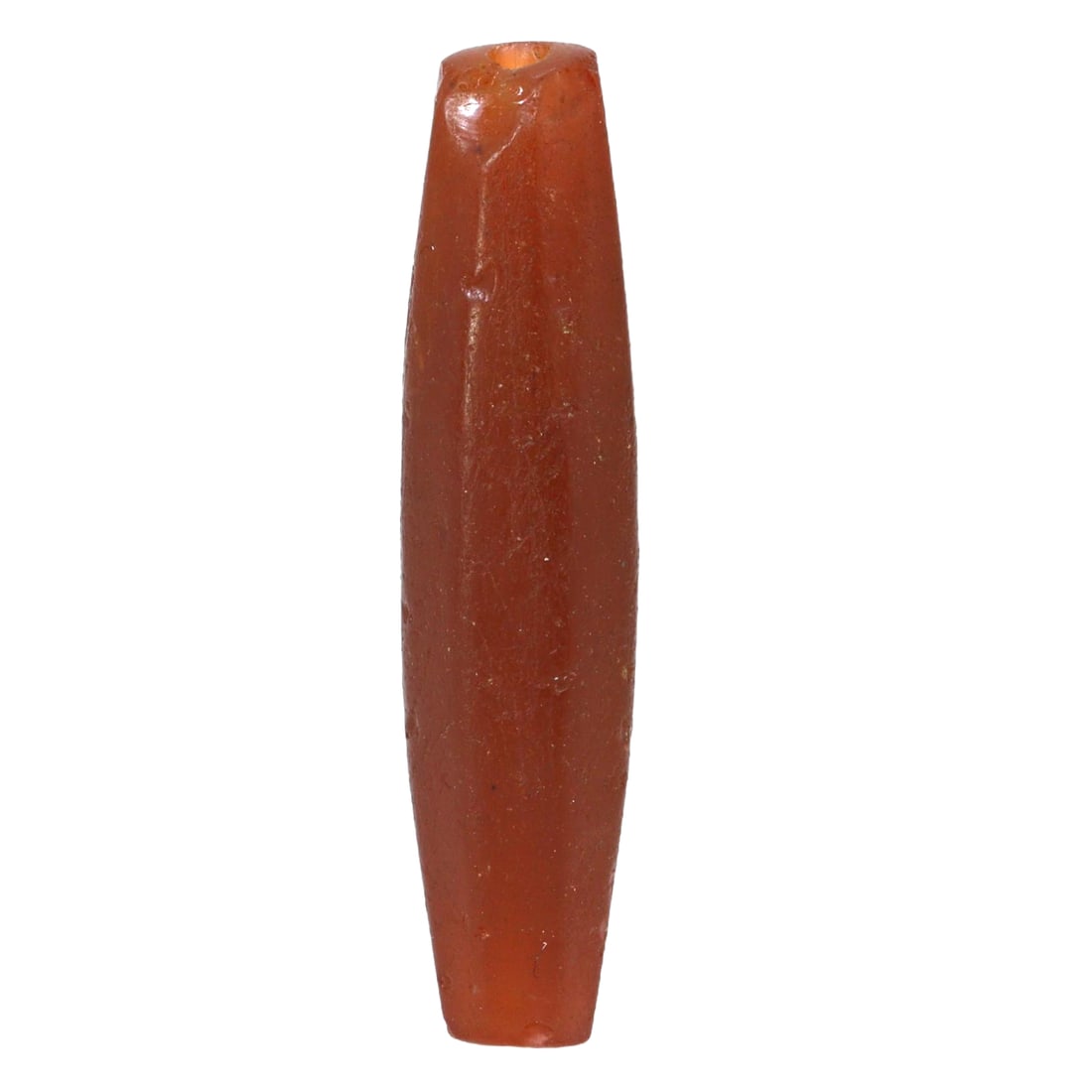 A Bohemian Antique Carnelian Bead, 19th Century: This substantial carnelian bead from Bohemia and Moravia, regions renowned for their skilled gem cutting and glasswork in the 19th century, showcases the vibrant depth of color and fine polish that ca