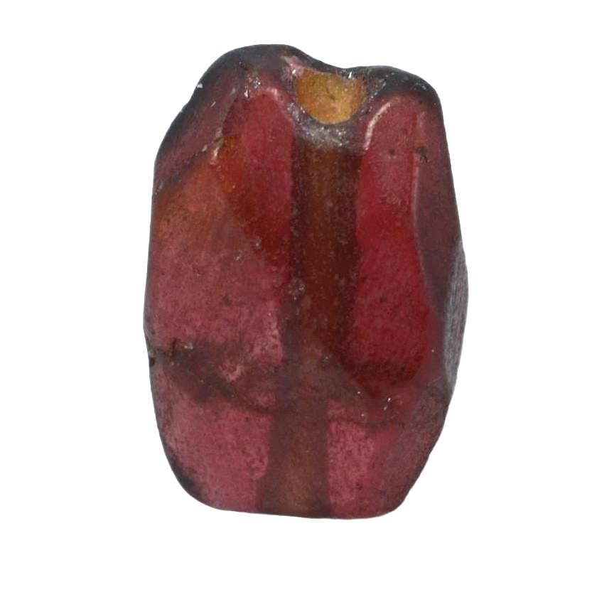Antique Medieval Red Garnet Bead, c. 8th–15th Century CE: Crafted during the Middle Ages, a time rich in artisanal innovation, this red garnet bead displays the period's shaping skills. Garnets were highly valued for their perceived protective properties and