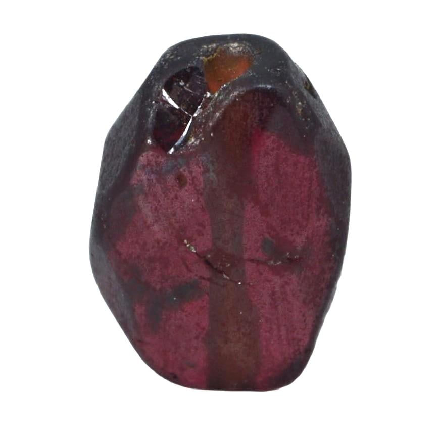 Antique Medieval Red Garnet Bead, c. 8th–15th Century CE: Crafted during the Middle Ages, a time rich in artisanal innovation, this red garnet bead displays the period's shaping skills. Garnets were highly valued for their perceived protective properties and