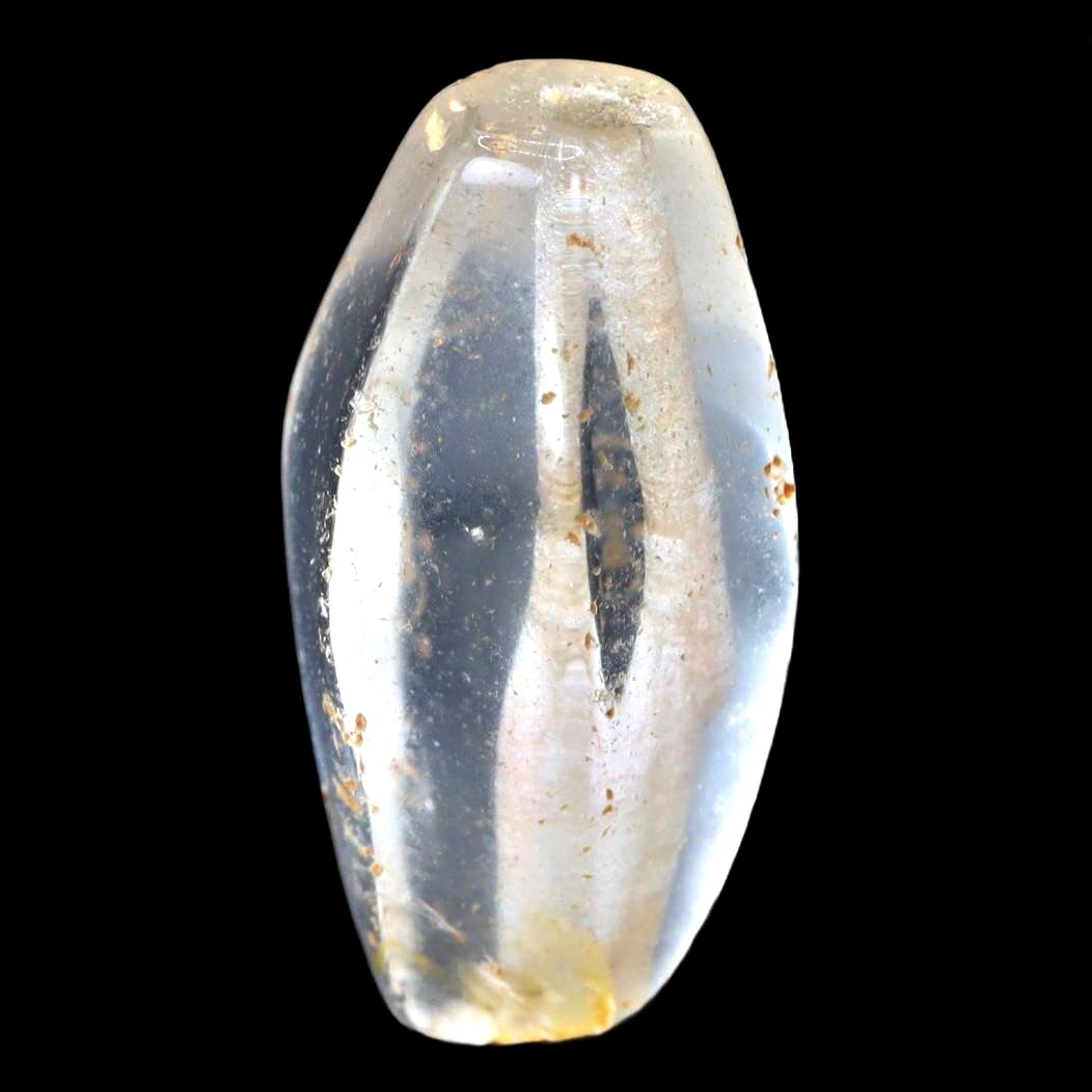 An Antique Mughal Empire Faceted Rock Quartz Bead, c. 16th-19th Century: Exemplifying the splendor of the Mughal Empire's fascination with crystal, this faceted rock quartz bead reflects the precision and skill of Mughal lapidaries. Its geometric facets catch the light, il
