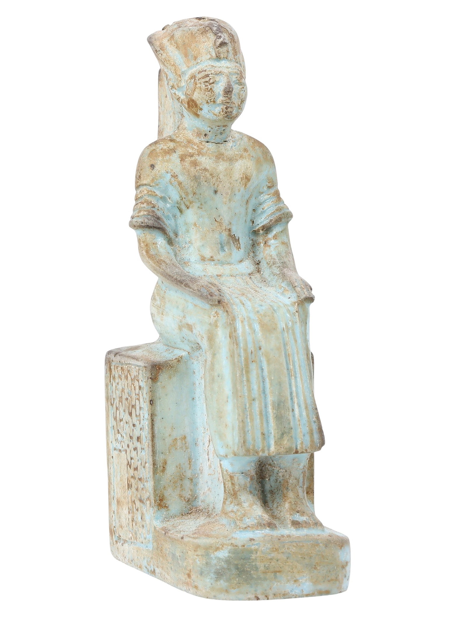 An Egyptian Faience Figurine, Late Period/Revival: Evoking the timeless allure of ancient Egypt, this faience figurine might represent a subject from the historic Late Period or be a contemporary revival piece. Its serene posture and delicate features