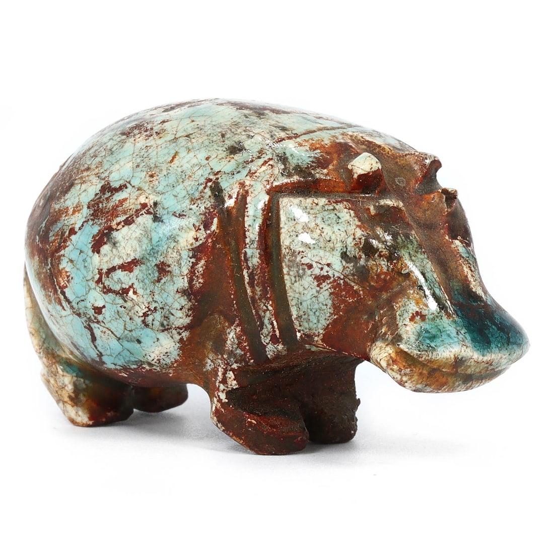 An Egyptian Glazed Steatite Hippopotamus, Late Period/Revival: This vibrant glazed steatite figurine, measuring 5.8 x 3.3 cm, depicts a hippopotamus, an animal that held significant meaning in ancient Egyptian culture, symbolizing both chaos and fertility. Whethe