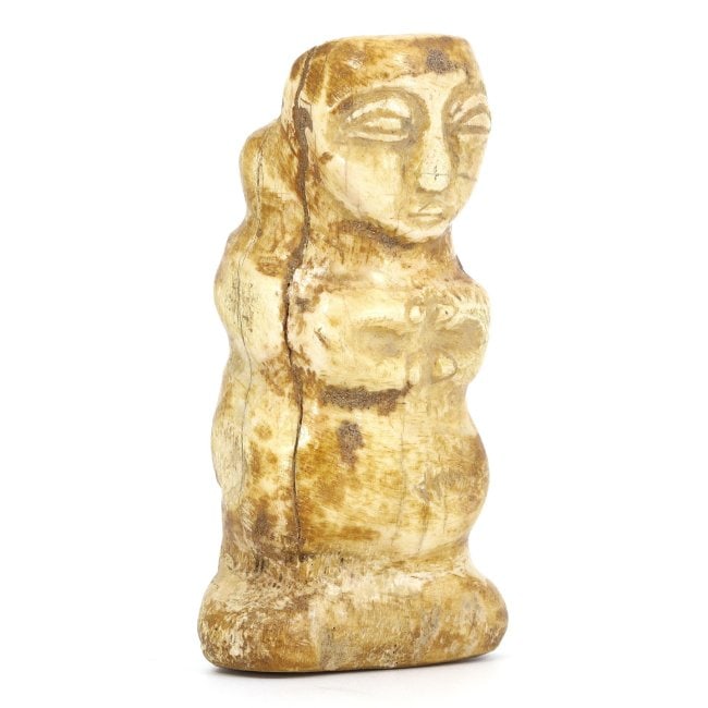 An Ancient Bactrian Bone Idol-Container Carving, 2nd Millennium BCE: Discover this intricate Bactrian bone carving, measuring 8.3 by 3.5 cm. This artifact, doubling as a container, is from the 2nd millennium BCE, representing a remarkable blend of utilitarian design an