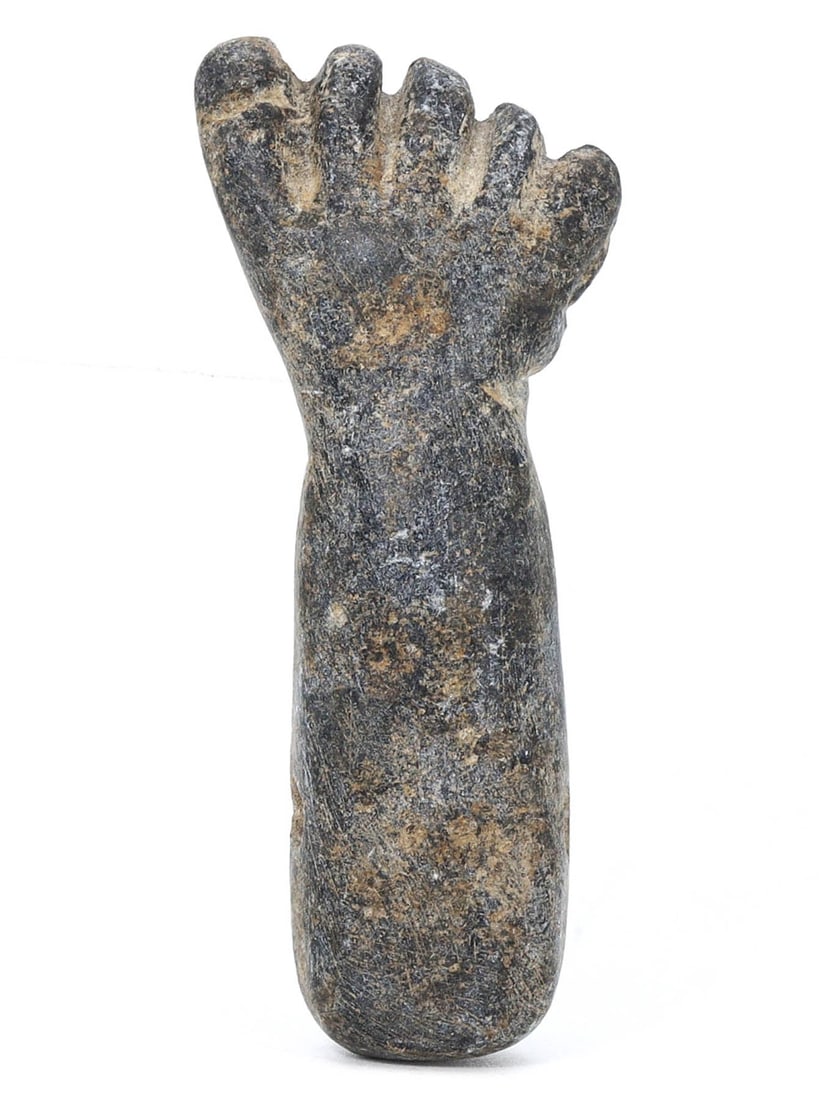An Ancient Egyptian Steatite Fist Bead, Late Period, 664-332 BC: This steatite bead carved into a fist was likely worn as an amulet in Ancient Egypt. Symbolizing strength and protection, such beads were commonly threaded into necklaces and bracelets, serving as bot