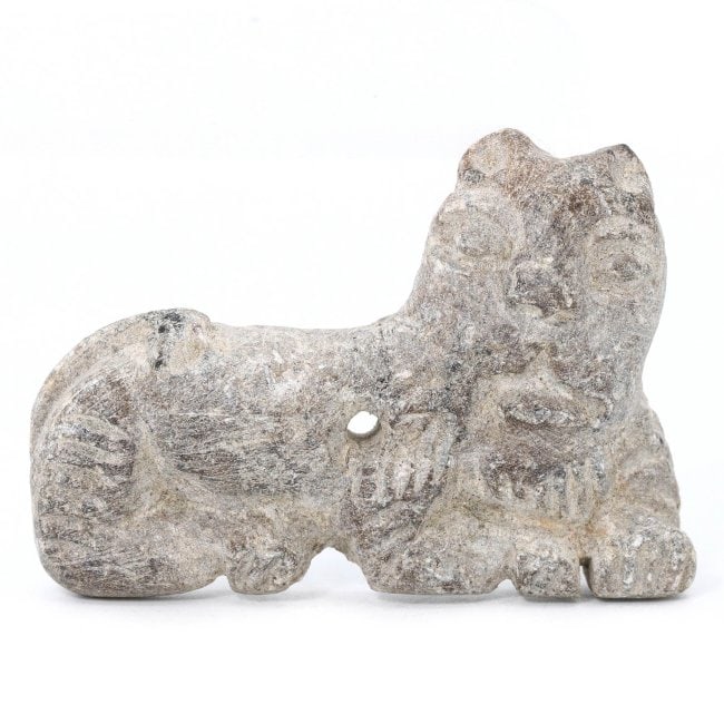 Ancient Steatite Mesopotamian Feline Figurine, Circa 2nd Millennium BCE: Feast your eyes on this steatite lion figurine, standing at 4.8 by 3 cm, an emblematic piece from the 2nd millennium BCE. Its raw and primitive aesthetic captures the essence of early artisanship, whe
