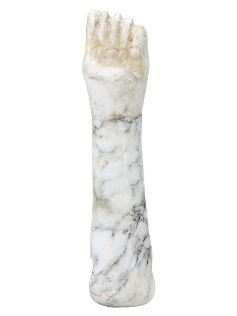 An Ancient Egyptian Alabaster Fist Amulet, Late Period, 664-332 BC: Resplendent in its simplicity, this alabaster fist amulet from the Late Period of ancient Egypt conveys power and authority. Often associated with strength and protection, fist amulets were common per