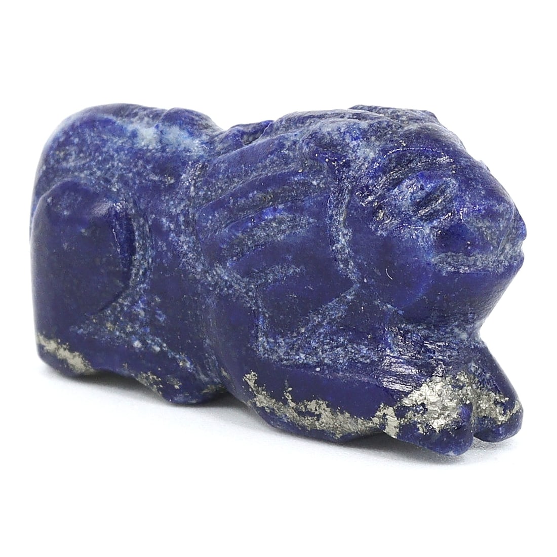 An Ancient Near Eastern Lapis Lazuli Feline Amulet, 2nd Millennium BCE: An exquisite representation of Near Eastern artistry, this lapis lazuli amulet of a feline exemplifies the region's skill in capturing form and essence in precious stone. Revered for its deep blue hue