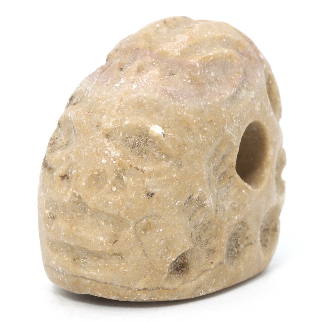Ancient Byzantine Limestone Stamp Seal with Humanoid Face, ca. 4th-7th Century AD: This Byzantine-era limestone seal features a stylized humanoid face, indicative of the era's iconographic symbolism. As a personal seal, it served as a mark of identity and authority, often pressing i