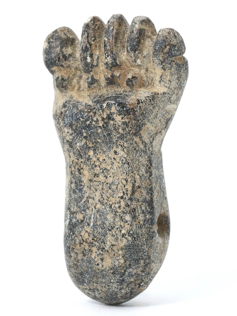 An Ancient Egyptian Steatite Fist Bead, Late Period, 664-332 BC: A steatite bead carved in the shape of a clenched fist, an Egyptian amulet believed to confer strength and protection. This piece reflects the Late Period's fascination with symbolism and the wearable