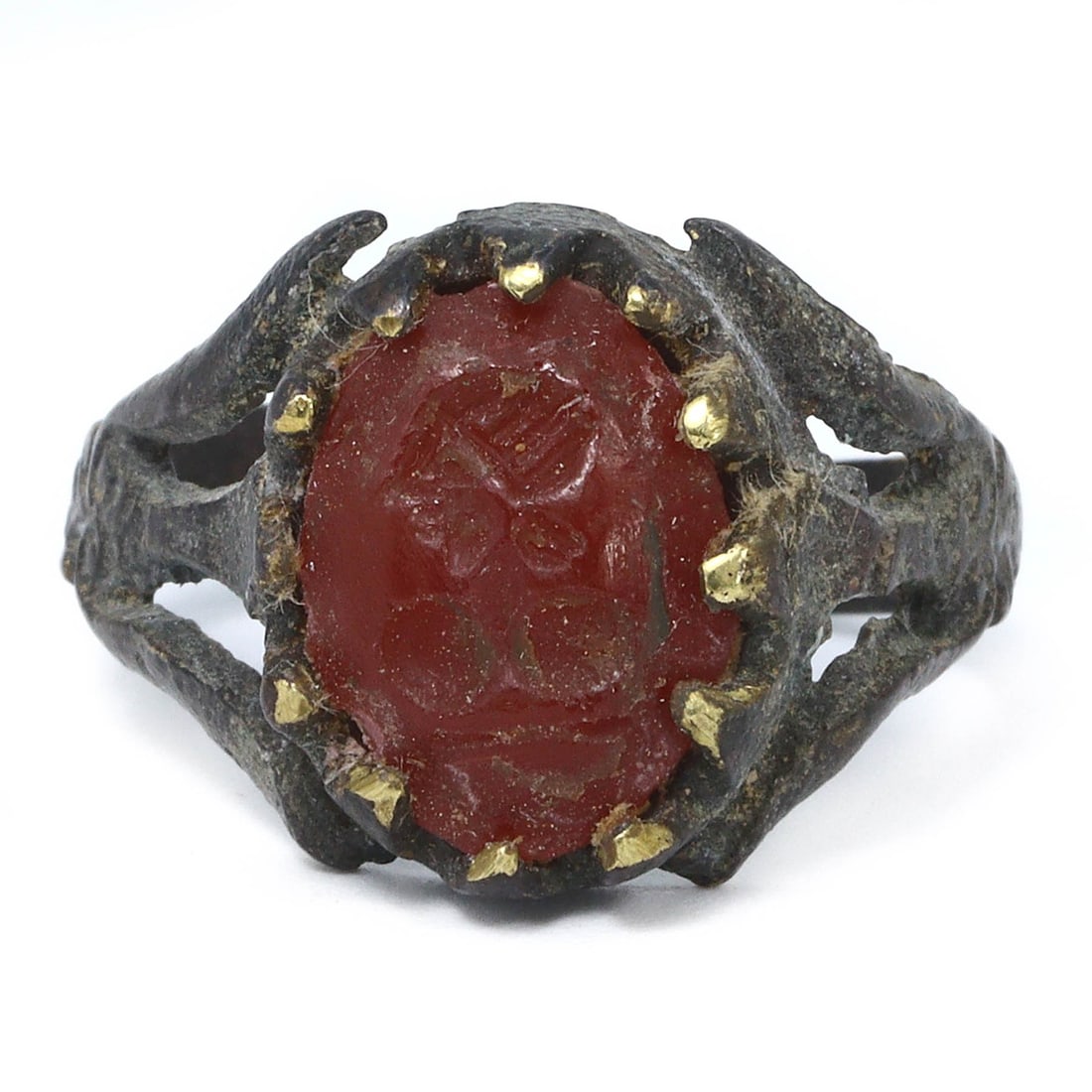 An Ancient Persian Gold Gilt Ring with Carnelian Beads, 1st Millennium BCE: An ancient bronze ring from Persia, featuring an engraved stamp seal, dating back to the 1st millennium BCE. This ring, size 8.25 US, is crafted with a bronze band and a distinctive rectangular stamp 