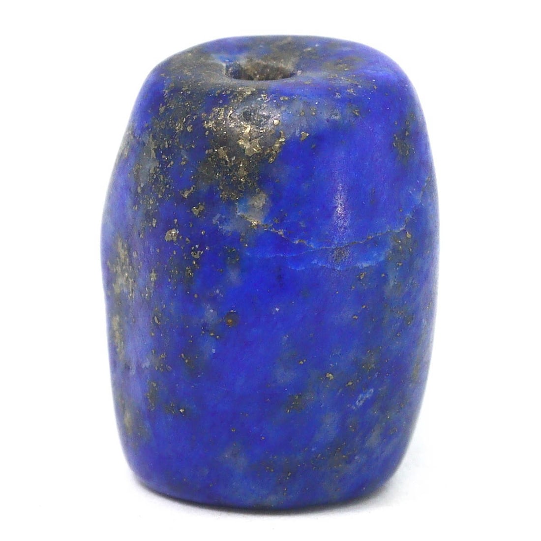 An Islamic Abbasid or Seljuk Empires Lapis Lazuli Bead, c. 8th–14th Century CE: A gem from the Islamic Golden Age, this lapis lazuli bead, with its deep celestial blue, is a relic of the Islamic empires' prosperity, where such materials were coveted for their beauty and supposed 