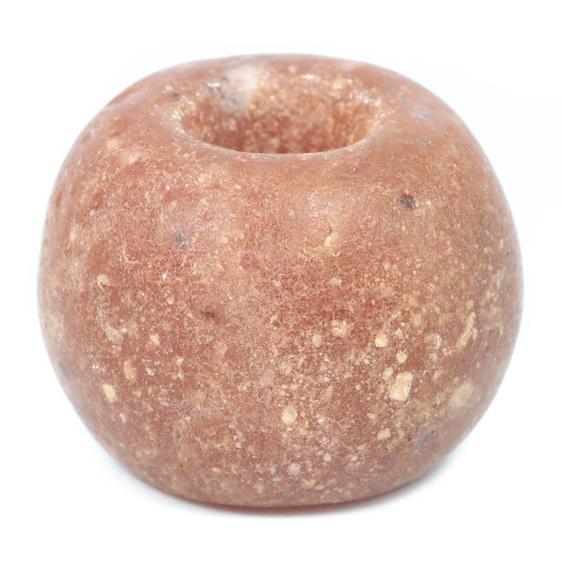 An Antique Speckled Pink Glass Bead, ca. 20th Century: This charming speckled pink glass bead, measuring 2 x 1.5 cm, displays a subtle yet captivating appearance with its warm, pink hue interspersed with lighter speckles. The bead’s rounded, robust form