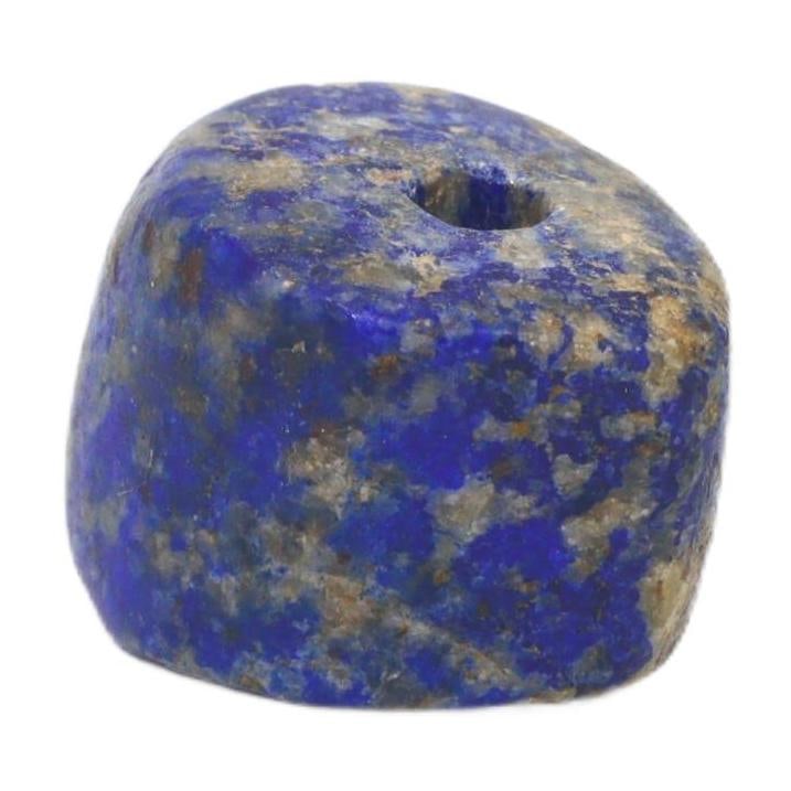 Ancient Mesopotamia Neo-Babylonian Lapis Lazuli Bead, c. 626-539 BCE: This bead, carved from the treasured lapis lazuli, is a remnant of the Neo-Babylonian period, reflecting the luxury and ritual significance associated with the stone in that era. Lapis lazuli was este
