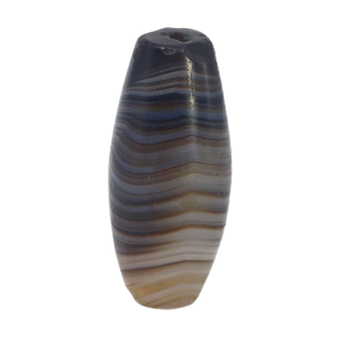 An Ancient Tibetan Banded Agate Chung Dzi Bead, 6th-10th Century AC: This chung dzi bead, with its enigmatic dark hues and stark banding, is a quintessential artifact of Tibetan culture. Dzi beads are deeply rooted in Tibetan tradition, often used as protective amulets