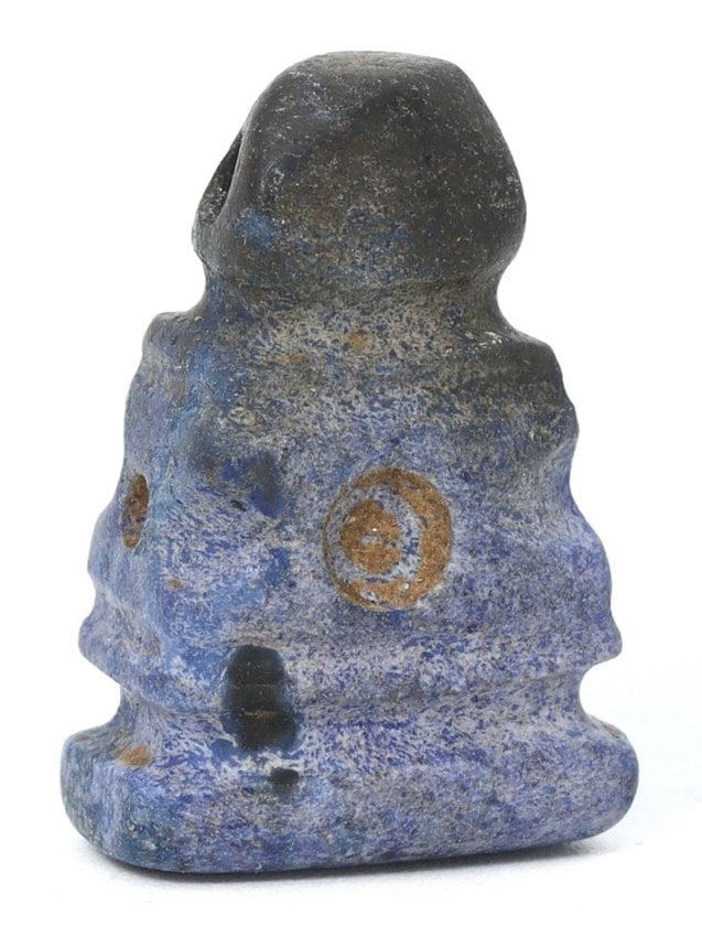 An Ancient Lapis Lazuli Pillar-Shaped Amulet, Circa 1st Millennium BCE: This exquisite lapis lazuli amulet, modest in size at 0.59 by 0.39 inches (1.5 by 1 cm), likely originates from the 1st millennium BCE. Its pillar-like form is characteristic of ancient beadwork, symb