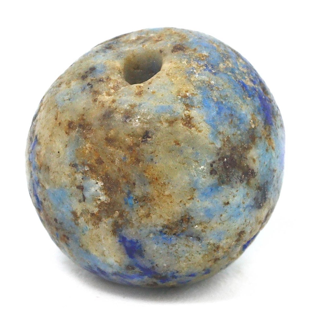 Ancient Mesopotamia Neo-Babylonian Lapis Lazuli Bead, c. 626-539 BCE: This bead, carved from the treasured lapis lazuli, is a remnant of the Neo-Babylonian period, reflecting the luxury and ritual significance associated with the stone in that era. Lapis lazuli was este