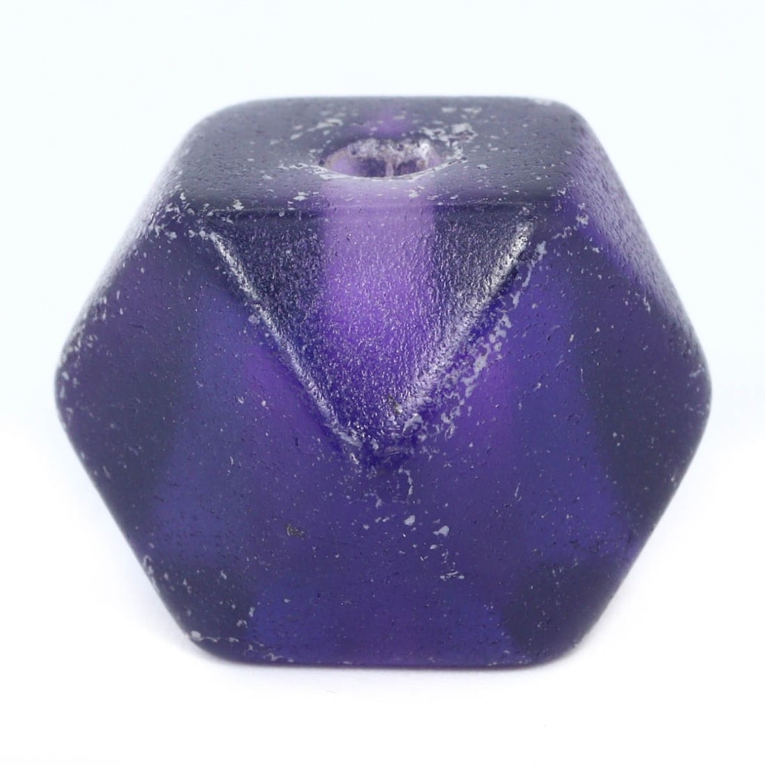 An Antique Mughal Empire Carved Amethyst Bead, c. 16th-18th Century: This regal amethyst bead, expertly carved and polished, is reminiscent of the opulent Mughal era, when such gemstones were favored in royal jewelry. The bead’s faceted surfaces reflect the Mughals' 