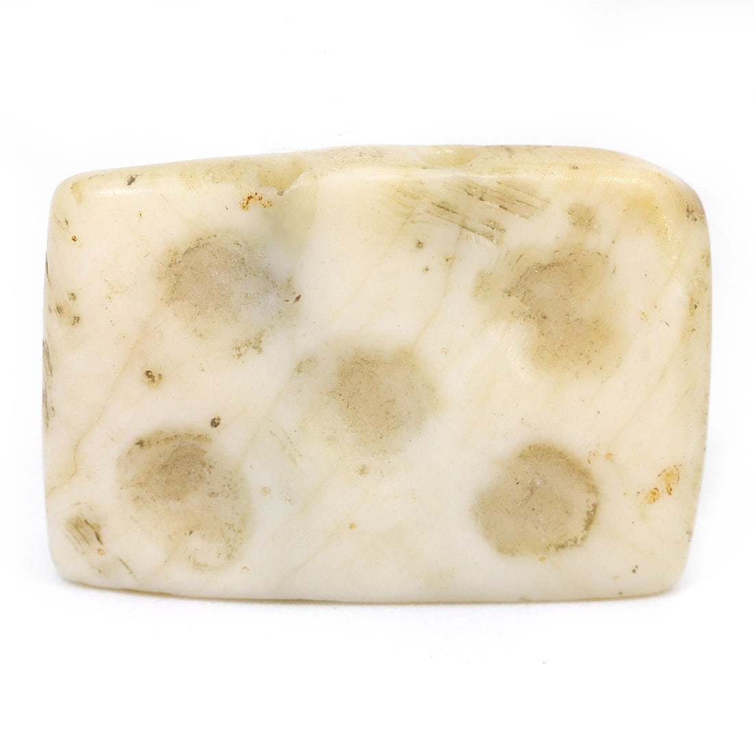 An Ancient Persian Conch Dice with Five Dot Pattern, 1st Millennium BCE: An ancient Persian dice, crafted from conch or bone in the 1st millennium BCE. This compact artifact features a five-dot pattern, reminiscent of traditional dice designs, indicating its possible use i