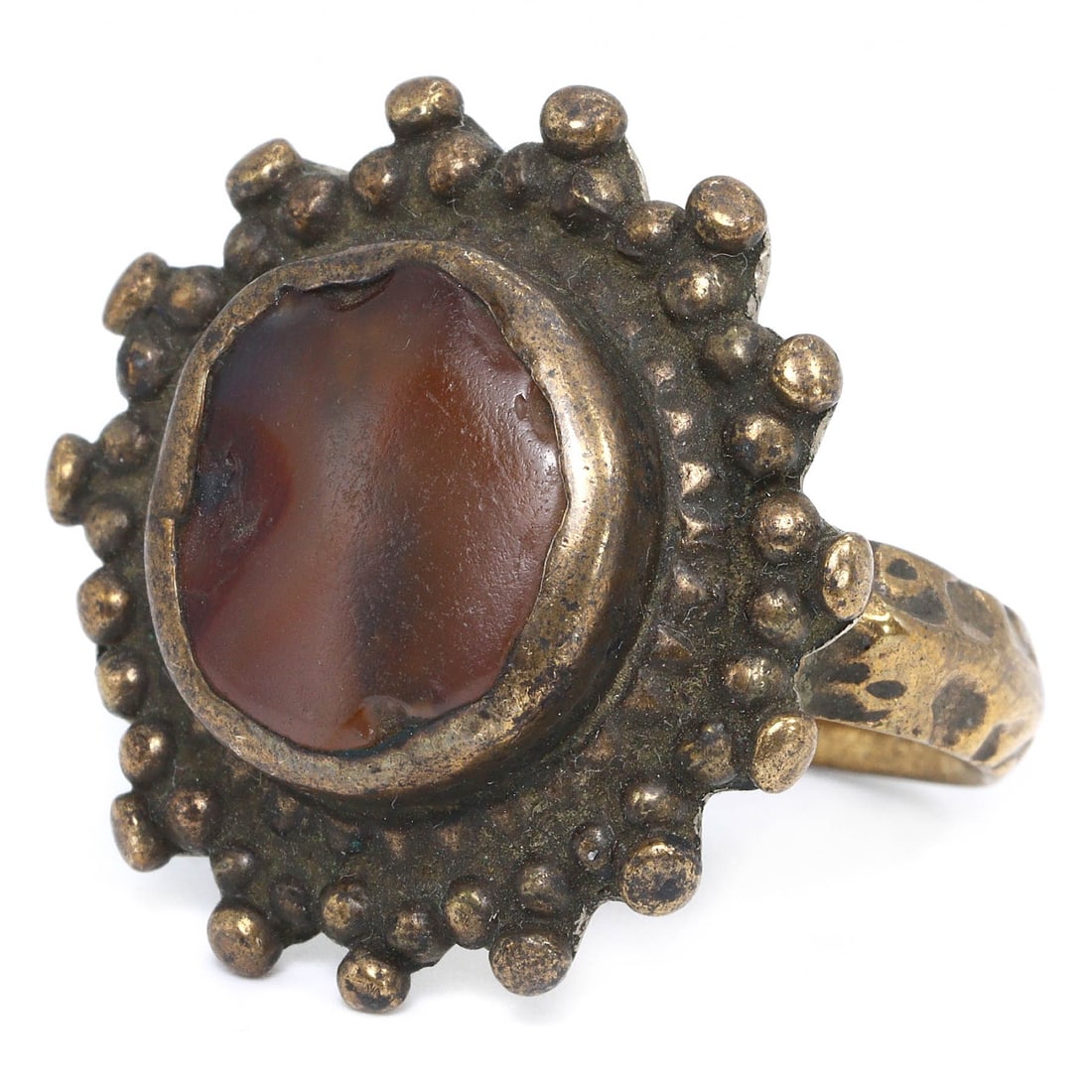 An Ancient Persian Gold Gilt Ring with Carnelian Beads, 1st Millennium BCE: An ancient bronze ring from Persia, featuring an engraved stamp seal, dating back to the 1st millennium BCE. This ring, size 8.25 US, is crafted with a bronze band and a distinctive rectangular stamp 