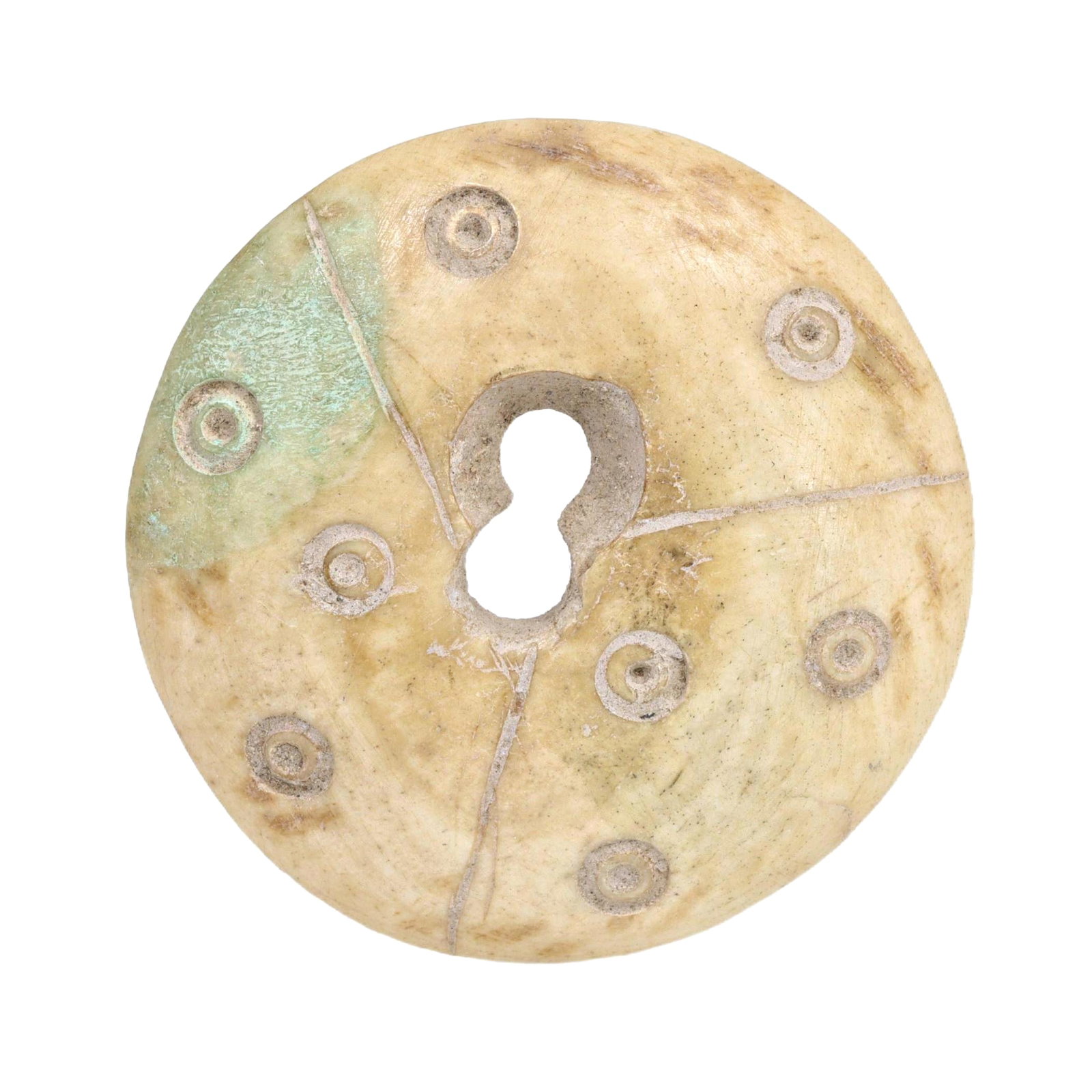 An Ancient Nishapur Carved Bone Button, c. 10th-11th Century CE: Category: Beads and Jewelry Components This delicately carved bone button from Nishapur features intricate circular patterns, typical of the geometric artistic style prevalent during the Islamic Golde