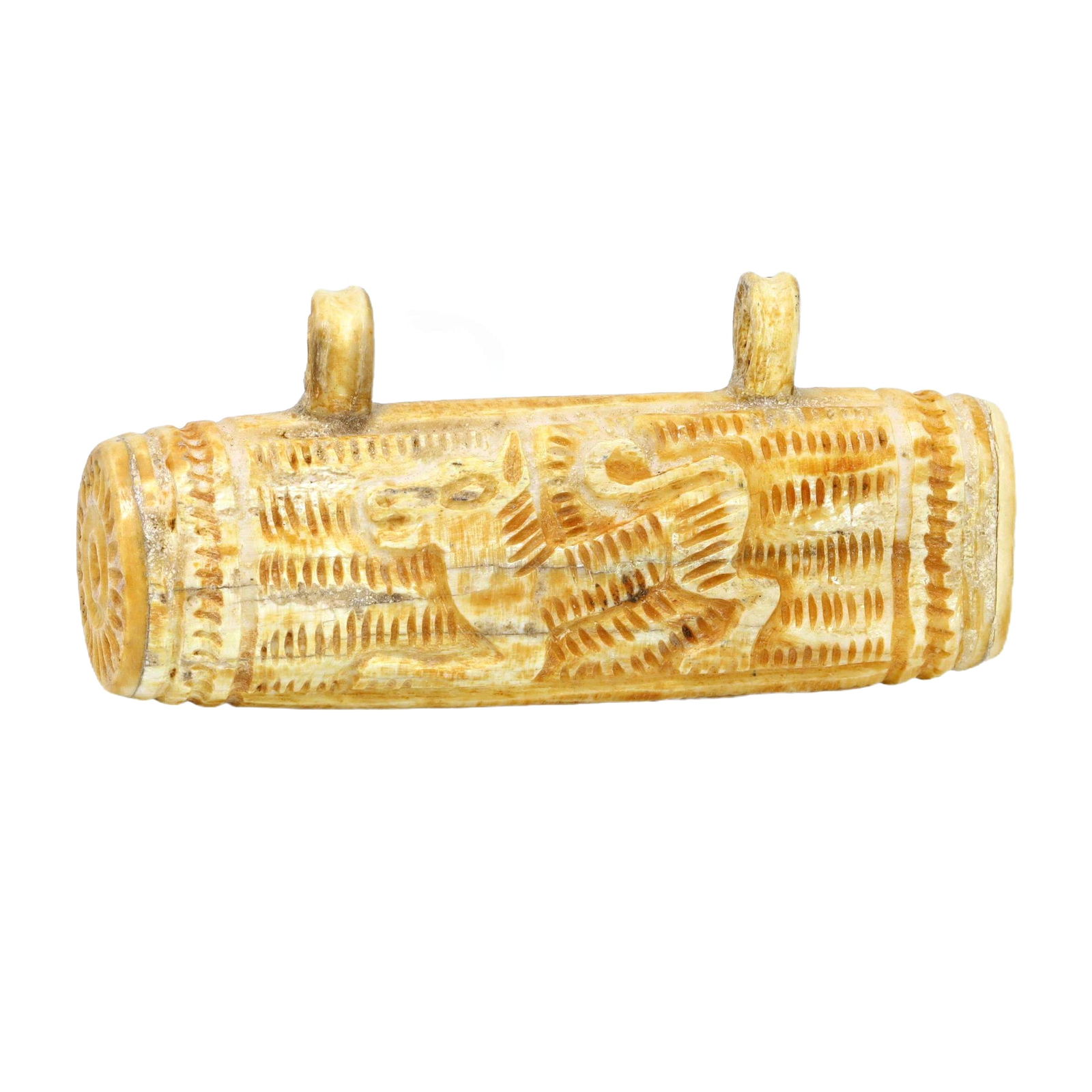 An Antique Islamic Carved Bone Amulet Locket, c. 9th-10th Century CE: This finely carved bone amulet locket from the Islamic Golden Age, circa 9th to 10th century CE, exemplifies the intricate artistry and cultural significance of personal adornments from this period. T