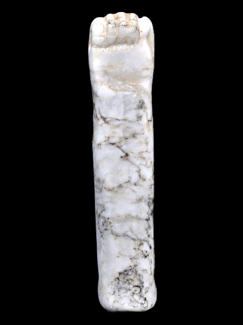 An Ancient Egyptian Alabaster Fist Amulet, New Kingdom, c. 1570-1069 BCE: This alabaster fist amulet from the New Kingdom of Egypt is an exceptional example of protective symbolism used during the period. Such amulets were believed to provide strength and power to the beare