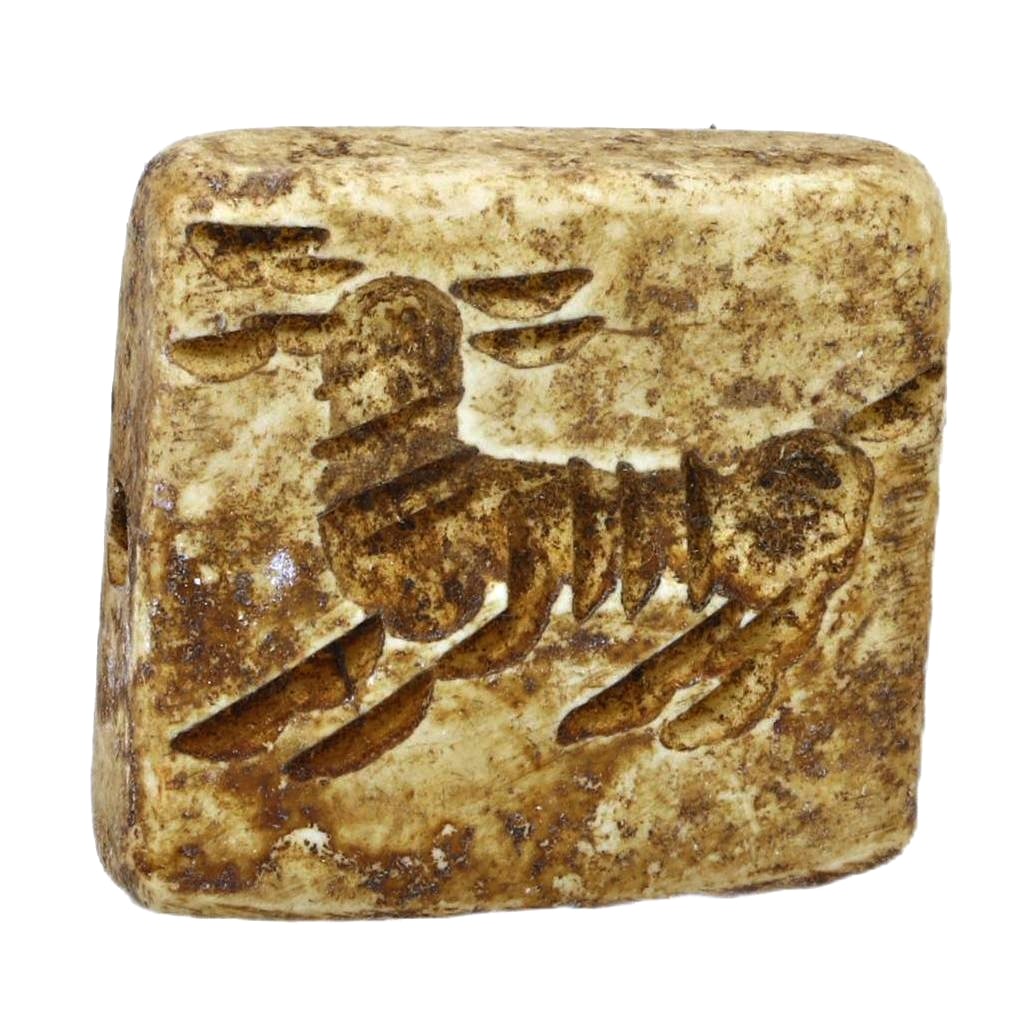 An Ancient Persian Dice-Backed Stamp Seal, c. 1st Millennium BCE: Category: Sealings This unique artifact, an ancient Persian stamp seal featuring a dice-backed design, dates back to the 1st millennium BCE. It combines practical function with a gaming element, refle