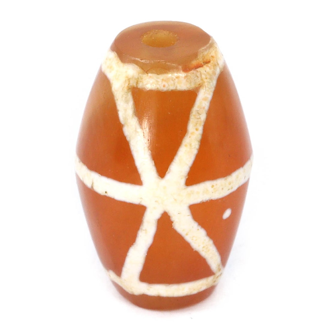 An Antique Himalayan Tibetan Etched Dzi Bead, c. 1000-1200 CE: Category: Beads and Necklace Components This dzi bead, featuring a distinctive cross pattern etched into its surface, is a revered object from the Tibetan cultural heritage. The cross symbol, often as