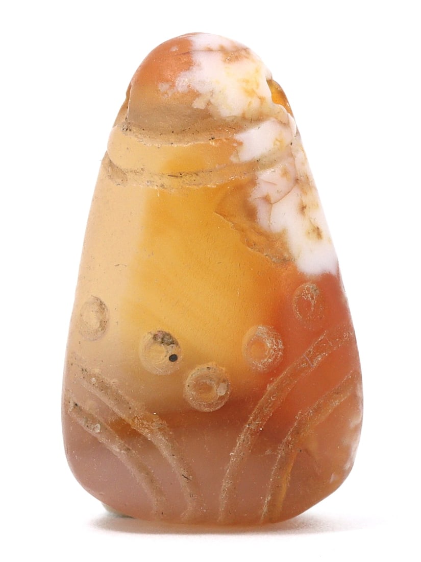 An Ancient Coptic Carnelian Pyramid Amulet, c. 4th-7th Century CE: Category: Pendants and Figurines This carnelian amulet, tracing back to the Coptic period of Egypt, features engraved symbols believed to offer protection and spiritual guidance to its bearer. Such am