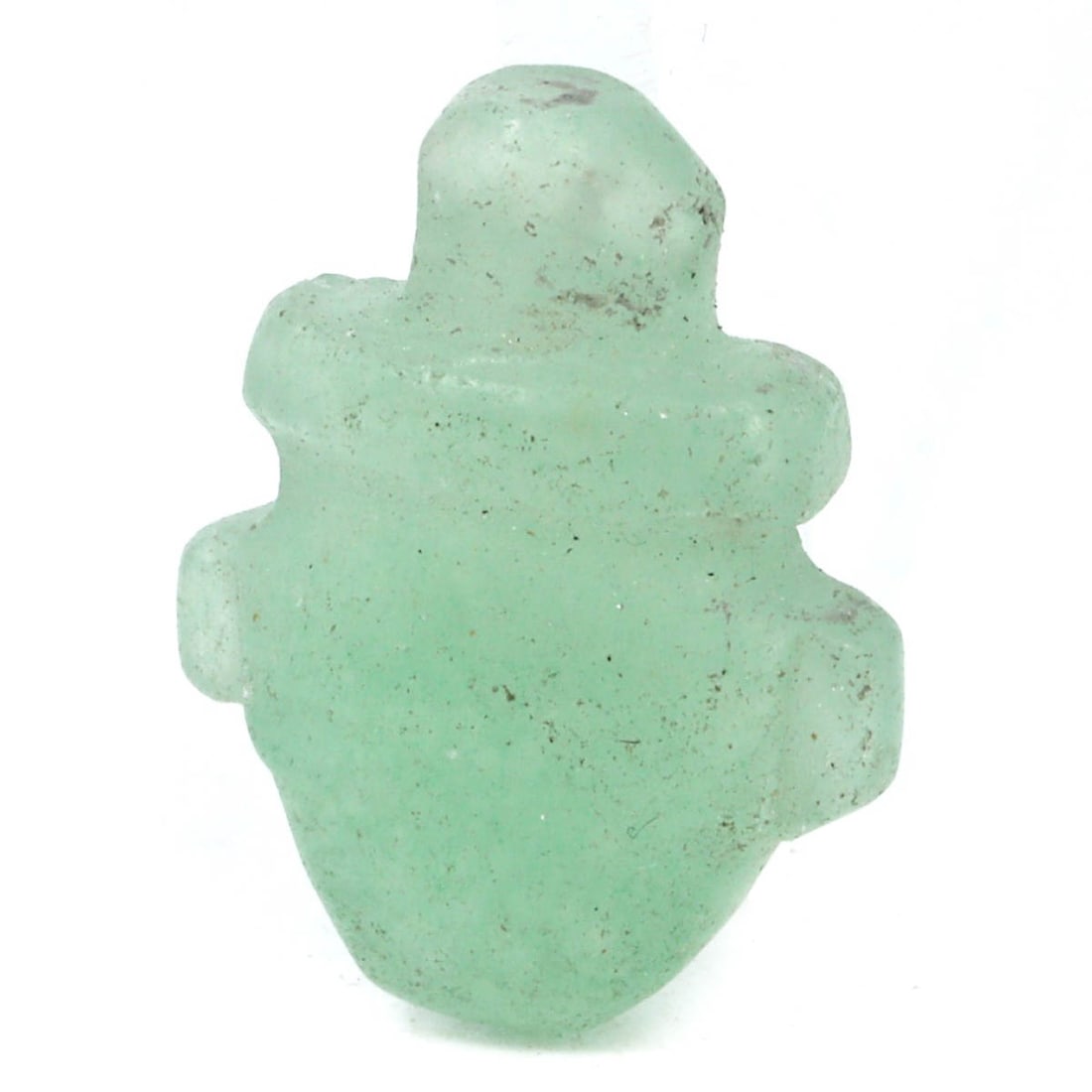 An Ancient Coptic Egyptian Carnelian Figurine Amulet, ca. 3rd-4th Century CE: This Coptic Egyptian carnelian amulet, carved into a stylized human figurine, represents ancient protective rituals. Its greenish hue and smooth finish highlight the skillful artisanship, with carneli