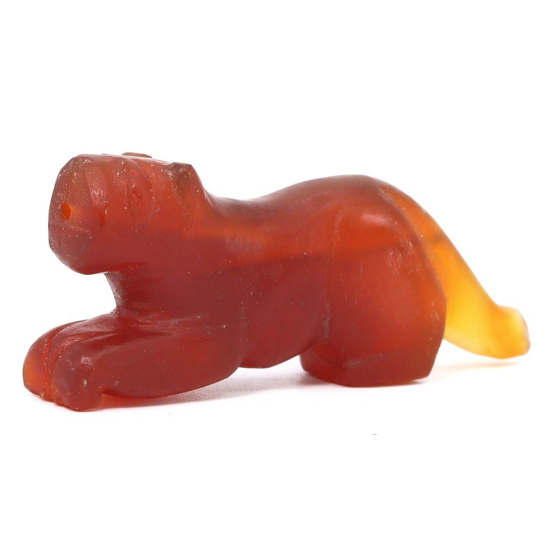 An Antique Himalayan Carnelian Zoomorphic Tiger Amulet, 18th Century: This carnelian tiger amulet from the 18th century embodies the vibrant cultural essence of the Himalayan region. Not ancient but of notable antique grade, the amulet showcases the enduring artistic pr