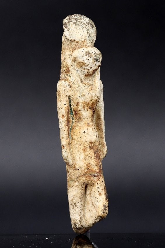 An Antique Egyptian Revival Faience Sekhmet Statuette, Circa 1920s: This statuette represents Sekhmet, the ancient Egyptian goddess of war and healing, depicted in faience with meticulous craftsmanship typical of the 1920s Egyptian Revival. The deity's fierce lioness 