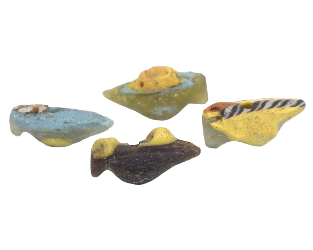 A Collection of Four Ancient Roman-Byzantine Glass Bird Form Beads, c. 1st-5th Century CE: These four glass beads, shaped like birds and dating from the Roman to Byzantine periods, demonstrate the continuity and evolution of glassworking techniques over several centuries. The vibrant colors