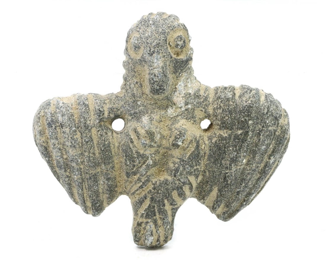 An Ancient Steatite Bird Figurine from the 2nd Millennium BCE: This artifact hails from the height of the Bronze Age, a period marked by significant cultural and technological advancements. The bird, meticulously carved from soapstone, exhibits the stylized forms