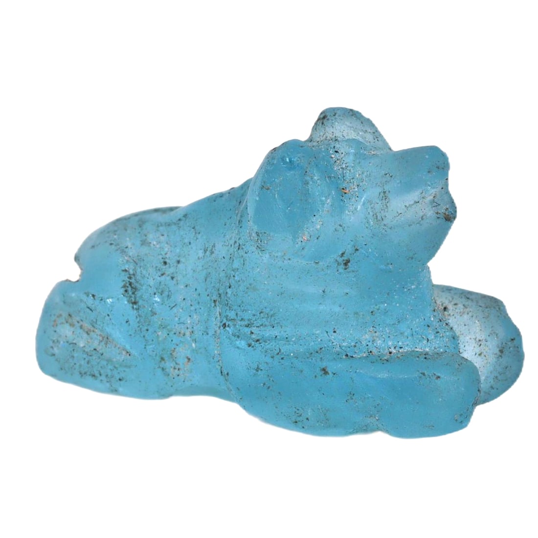 An Ancient Coptic Egyptian Blue Glass Zoomorphic Amulet, 3rd-6th Century CE: This Coptic Egyptian blue glass amulet, dating from the 3rd to 6th century CE, features a zoomorphic design, possibly depicting a lion or a mythical creature, indicative of the period's artistic and r