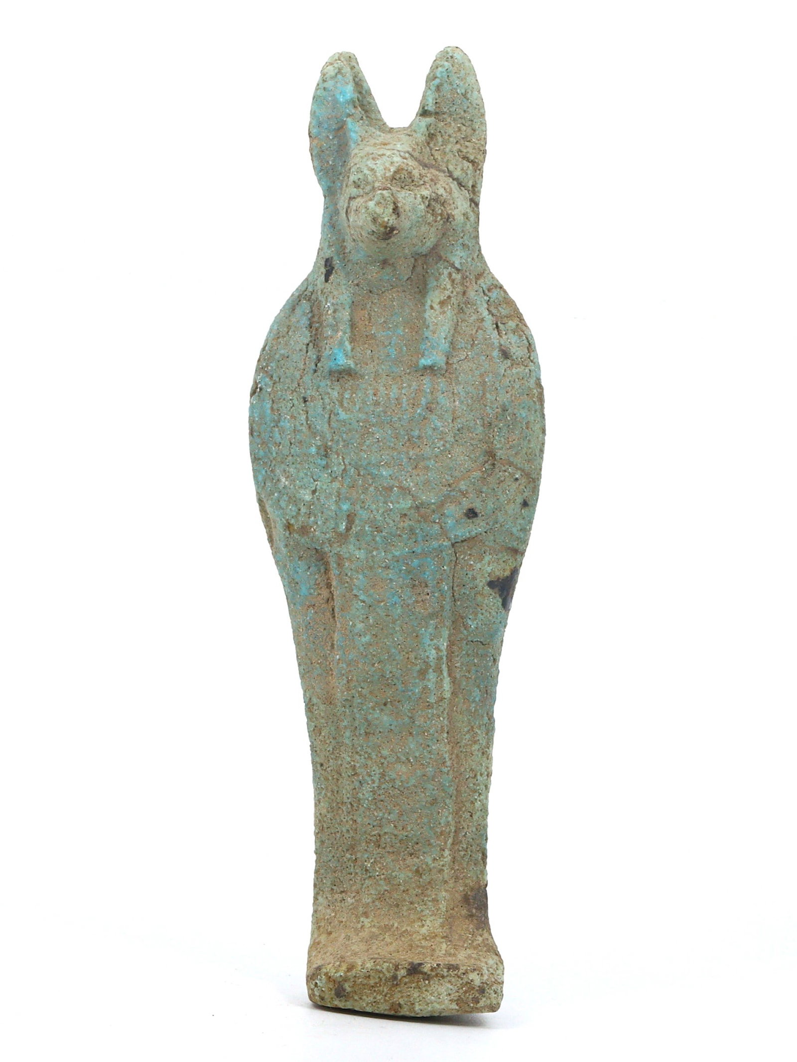 An Antique Egyptian Revival Faience Statuette of Anubis, c. 19th Century CE: This statuette features Anubis, crafted from faience to mirror the artistic styles of Egypt's Late Period and designed during the 19th-century Egyptian Revival. It serves as a decorative piece that sy