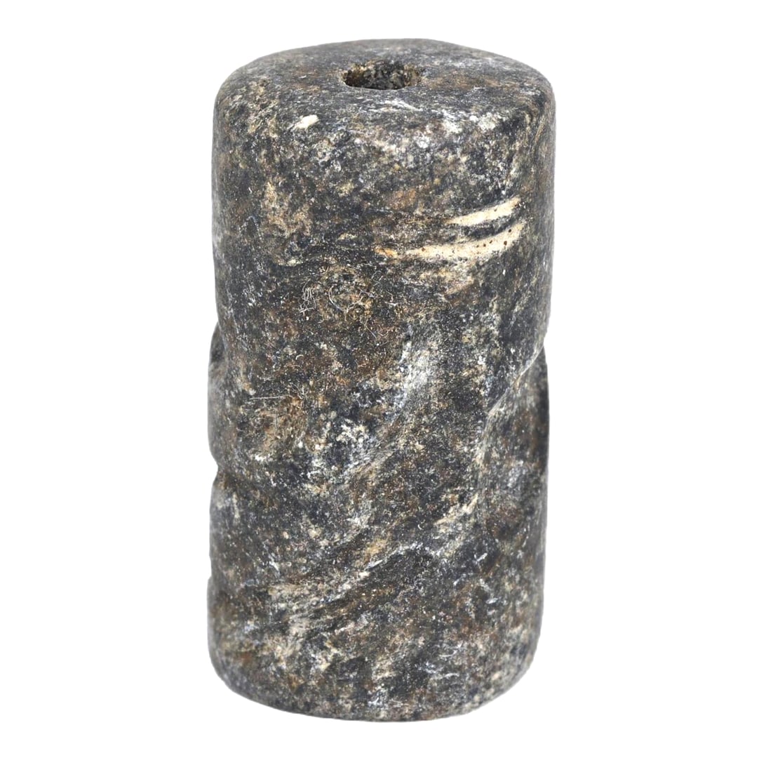 Ancient Neo-Sumerian Ur III Period Steatite Cylinder Seal, c. 2112-2004 BCE: This cylinder seal from the Neo-Sumerian period, specifically the Ur III dynasty, features intricate carvings that include symbolic representations of religious rituals or celestial beings, reflecting