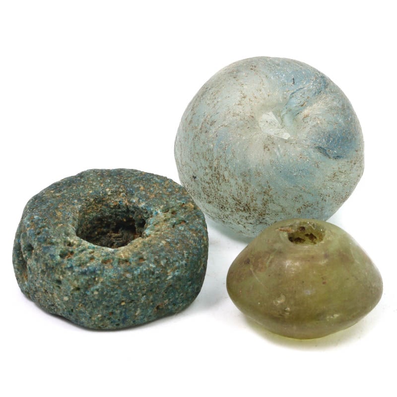 Assorted Ancient Glass Beads in Varied Shapes, Circa 1st Century BCE: Category: Beads and Jewelry ComponentsThis unique assortment of ancient glass beads, featuring cylinder, disk, short convex bicone, and round tabular shapes, dates back to the 1st century BCE. The var